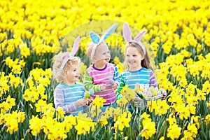 Kids with bunny ears on Easter egg hunt