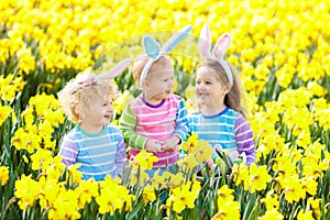 Kids with bunny ears on Easter egg hunt