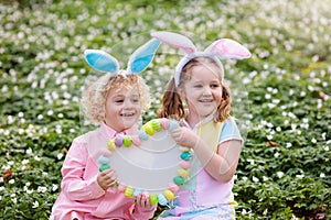 Kids with bunny ears on Easter egg hunt