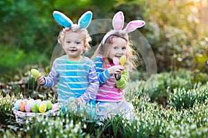 Kids with bunny ears on Easter egg hunt