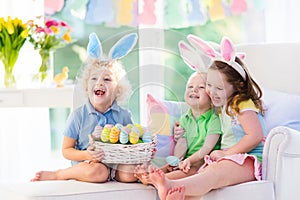 Kids with bunny ears on Easter egg hunt