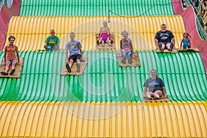 Kids on carnival slide at state fair