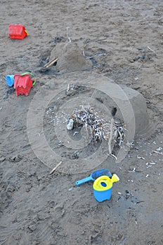 Kids castle and toys in sand