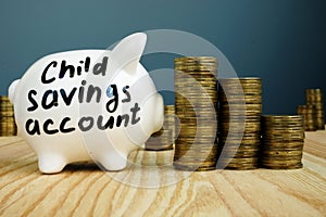 Kids or child savings account written on piggy bank