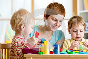 Kids or children and mother play colorful clay toy