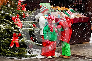 Kids at Christmas fair. Child at Xmas market.