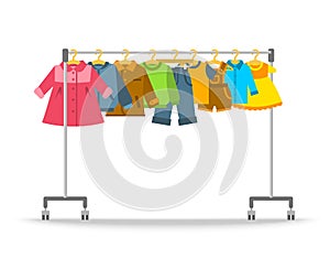 Kids clothes hanging on hanger rack