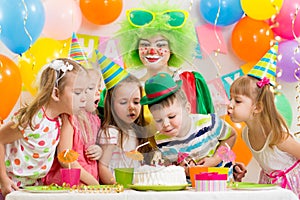 Kids with clown celebrating birthday party