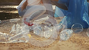 kids collecting trash volunteer a teamwork. child group happy family on collects garbage plastic trash waste bottles