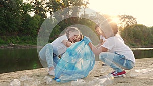 kids collecting trash volunteer a teamwork. child group happy family ecology on collects garbage plastic trash waste