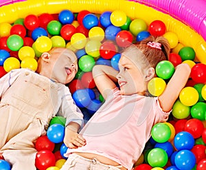 Kids in colored ball.
