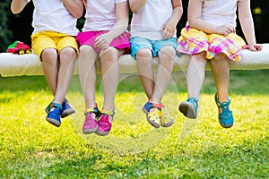 Kids with colorful shoes. Children footwear