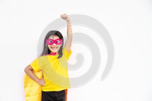 Kids concept, smiling girl playing super hero on white background