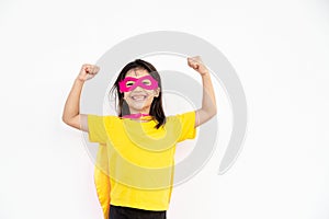 Kids concept, smiling girl playing super hero on white background