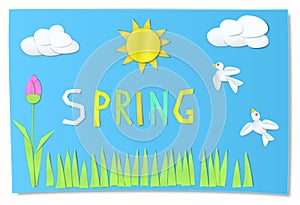 Kids cut paper art for spring.