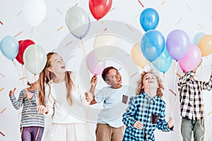 Kids dancing with balloons