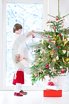 Kids decorating Christmas tree