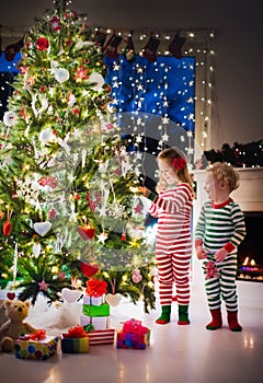 Kids decorating Christmas tree