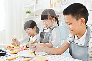 Kids decorating cookies.