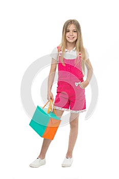 Kids designer clothing summer sale. Girl cute teenager carries shopping bag. Kid bought clothing summer sale. Sale