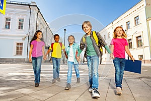 Kids diversity walking together holding hands
