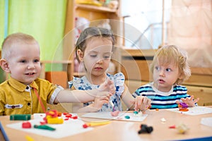 Kids doing arts and crafts in day care kindergarten