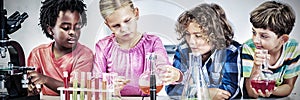 Kids doing a chemical experiment in laboratory