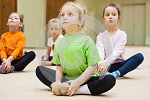 Kids doing exercise in gym