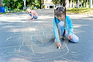 Kids drawing with chalk