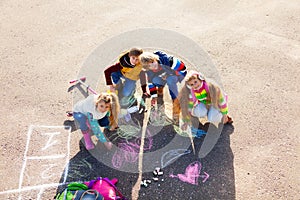 Kids drawing with chalk