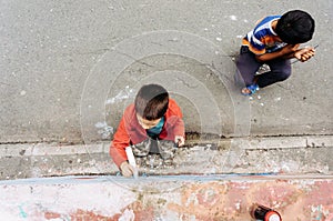 Kids drawing graffiti