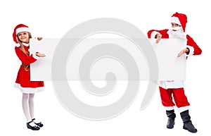 Kids dressed as santa offering you a copy space on banner