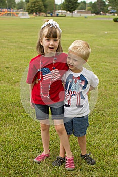 Kids dressed in patriotic American clothes for 4th of July