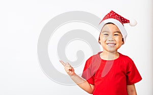 Kids dressed in red Santa Claus hat point finger