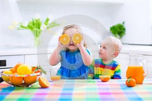 Kids drinking orange juice