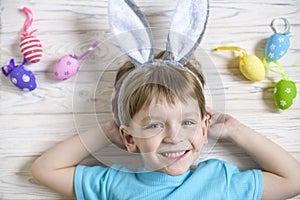 Kids on Easter egg hunt in blooming spring garden. Children searching for colorful eggs in flower meadow. Toddler boy and his brot