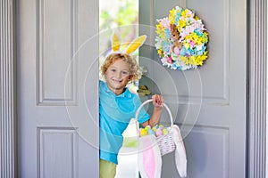 Kids Easter egg hunt. Child and eggs, bunny ears