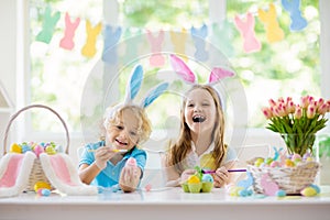 Kids on Easter egg hunt. Children dye eggs