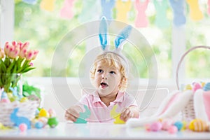 Kids on Easter egg hunt. Children dye eggs