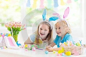 Kids on Easter egg hunt. Children dye eggs