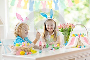 Kids on Easter egg hunt. Children dye eggs