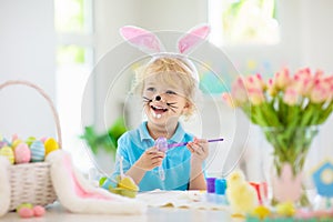 Kids on Easter egg hunt. Children dye eggs