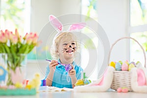 Kids on Easter egg hunt. Children dye eggs