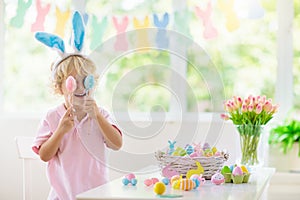 Kids on Easter egg hunt. Children dye eggs