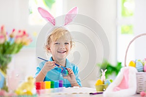 Kids on Easter egg hunt. Children dye eggs