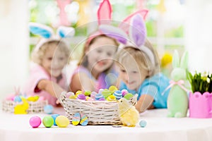 Kids on Easter egg hunt. Children dye eggs