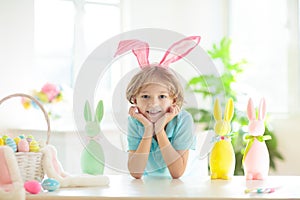Kids on Easter egg hunt. Children dye eggs
