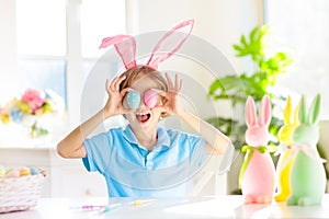 Kids on Easter egg hunt. Children dye eggs