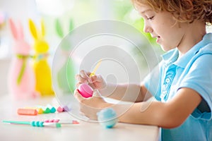 Kids on Easter egg hunt. Children dye eggs