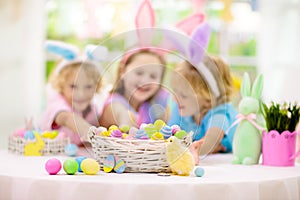 Kids on Easter egg hunt. Children dye eggs